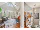 Bright and airy living room with high ceilings, large windows, and hardwood floors at 176 Sunset Bay Dr, Troutman, NC 28166