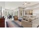 Spacious living room with modern decor, a dining area, and large windows at 176 Sunset Bay Dr, Troutman, NC 28166