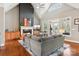Cozy living room featuring a fireplace, vaulted ceiling, and access to an outdoor space at 176 Sunset Bay Dr, Troutman, NC 28166