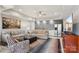 Comfortable living room with modern furnishings, a built-in bar, and ample seating at 176 Sunset Bay Dr, Troutman, NC 28166