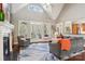 Bright living room with vaulted ceilings, a fireplace, and access to the backyard at 176 Sunset Bay Dr, Troutman, NC 28166