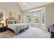 Spacious main bedroom with a large bay window offering natural light and views of the outdoors at 176 Sunset Bay Dr, Troutman, NC 28166