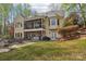 Spacious home with covered back patio and manicured lawn that offers outdoor enjoyment and relaxation at 176 Sunset Bay Dr, Troutman, NC 28166