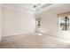 Spacious bedroom with carpet, ceiling fan, and two windows for natural light at 19221 Coachmans Trce, Cornelius, NC 28031