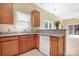 Well-appointed kitchen featuring wood cabinets, stainless steel appliances, and granite countertops at 19221 Coachmans Trce, Cornelius, NC 28031