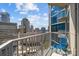 Balcony overlooking the city featuring a blue chair and metal railings at 210 N Church St # 2305, Charlotte, NC 28202