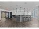 Modern bar area featuring sleek countertops and barstool seating and a tile wall at 210 N Church St # 2305, Charlotte, NC 28202