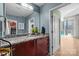 Stylish bathroom featuring granite countertops, modern fixtures, and a view of the balcony at 210 N Church St # 2305, Charlotte, NC 28202