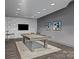 Well-lit game room featuring a pool table, seating, and stylish decor at 210 N Church St # 2305, Charlotte, NC 28202
