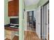 Home office features hard surface floors, modern cabinets, an integrated desk and a doorway to the primary bathroom at 210 N Church St # 2305, Charlotte, NC 28202