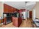 Modern kitchen features dark cabinets, black backsplash, stainless steel appliances, granite counters, and a center island at 210 N Church St # 2305, Charlotte, NC 28202