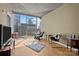 Bright living room featuring a large window with city views, hardwood floors, and stylish furniture at 210 N Church St # 2305, Charlotte, NC 28202