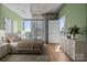 Inviting main bedroom with natural light, neutral tones, hardwood floors, and city views at 210 N Church St # 2305, Charlotte, NC 28202