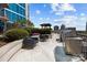 Outdoor patio featuring comfortable seating, a built-in grill, and city views at 210 N Church St # 2305, Charlotte, NC 28202