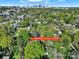 Aerial shot showcases this home's prime location near the city, nestled within a lush, tree-filled neighborhood at 2314 Wolfe St, Charlotte, NC 28205