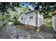 The side yard has a pea gravel area, landscaping, and a brick foundation adding character to the property at 2314 Wolfe St, Charlotte, NC 28205