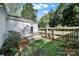 This backyard has a brick patio, landscaping and a gated fence, creating a private outdoor space at 2314 Wolfe St, Charlotte, NC 28205