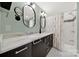 Stylish bathroom with double sinks, elegant mirrors, and a shower/tub combo with modern tiling at 2314 Wolfe St, Charlotte, NC 28205