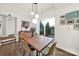 Bright dining room with hardwood floors, contemporary lighting, and sliding doors to a private outdoor space at 2314 Wolfe St, Charlotte, NC 28205