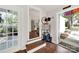 Inviting entryway featuring hardwood floors, ample natural light, and convenient access to both indoors and outdoors at 2314 Wolfe St, Charlotte, NC 28205