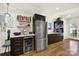 Well-equipped kitchen featuring stainless steel refrigerator, wine cooler and modern cabinets, blending style and functionality at 2314 Wolfe St, Charlotte, NC 28205