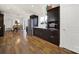 Open-concept kitchen with stainless steel appliances, white countertops, and hardwood floors for a modern touch at 2314 Wolfe St, Charlotte, NC 28205