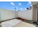 Private backyard with white fence, stone ground cover, and a small patio area at 309 River Clay Rd, Fort Mill, SC 29708