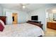 Comfortable bedroom boasts an attached bathroom and features soft natural light from the window at 309 River Clay Rd, Fort Mill, SC 29708