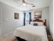 Comfortable bedroom featuring a plush bed, bedside table with lamp, and soft natural light at 309 River Clay Rd, Fort Mill, SC 29708