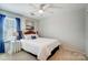 Simple bedroom design featuring a plush bed, bedside table, and soft natural light from the window at 309 River Clay Rd, Fort Mill, SC 29708