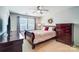 Cozy bedroom features a ceiling fan, dresser, and soft natural light from the window at 309 River Clay Rd, Fort Mill, SC 29708
