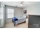 Quaint bedroom featuring soft natural light from the window and an armoire for storage at 309 River Clay Rd, Fort Mill, SC 29708