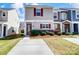 Charming townhome with neat landscaping and inviting curb appeal on a sunny day at 309 River Clay Rd, Fort Mill, SC 29708