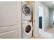 Efficient laundry area featuring a stacked washer and dryer unit in a hallway niche at 309 River Clay Rd, Fort Mill, SC 29708