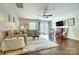 Bright living area with fireplace, ceiling fan, and sliding glass doors to the backyard at 309 River Clay Rd, Fort Mill, SC 29708