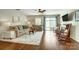 Bright living area with fireplace, ceiling fan, and sliding glass doors to the backyard at 309 River Clay Rd, Fort Mill, SC 29708