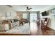 Bright living area with fireplace, ceiling fan, and sliding glass doors to the backyard at 309 River Clay Rd, Fort Mill, SC 29708
