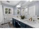 Beautiful bathroom features a double sink vanity with stone countertop and a large mirror at 3524 Johnny Cake Ln, Charlotte, NC 28226