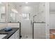 Modern bathroom with white subway tile in shower and glass door entry at 3524 Johnny Cake Ln, Charlotte, NC 28226