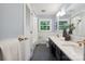 Chic bathroom featuring double sinks, marble countertops, subway tile, and modern fixtures at 3524 Johnny Cake Ln, Charlotte, NC 28226