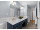Stylish bathroom showcasing a double sink vanity, large mirror, and modern fixtures at 3524 Johnny Cake Ln, Charlotte, NC 28226