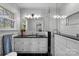 Bright bathroom with sleek tile design, glass shower and modern fixtures at 3524 Johnny Cake Ln, Charlotte, NC 28226