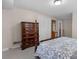 Bedroom with dark wood dresser, closet and full length mirror at 3524 Johnny Cake Ln, Charlotte, NC 28226