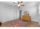 Spacious bedroom with wooden floors, large closet, and dresser at 3524 Johnny Cake Ln, Charlotte, NC 28226
