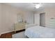 Bright bedroom with wooden floors, soft natural light, and a classic dresser at 3524 Johnny Cake Ln, Charlotte, NC 28226