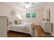 Charming bedroom with hardwood floors, a large window, and neutral decor for a calming atmosphere at 3524 Johnny Cake Ln, Charlotte, NC 28226