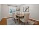 Comfortable dining room with six chairs and hardwood floors at 3524 Johnny Cake Ln, Charlotte, NC 28226