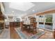 Combined dining area and kitchen with skylight, sliding doors to the patio, fireplace and breakfast bar at 3524 Johnny Cake Ln, Charlotte, NC 28226