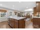 Open kitchen and dining area with wood floors and natural light at 3524 Johnny Cake Ln, Charlotte, NC 28226