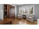 Cozy living room with hardwood floors, natural light, and matching armchairs at 3524 Johnny Cake Ln, Charlotte, NC 28226